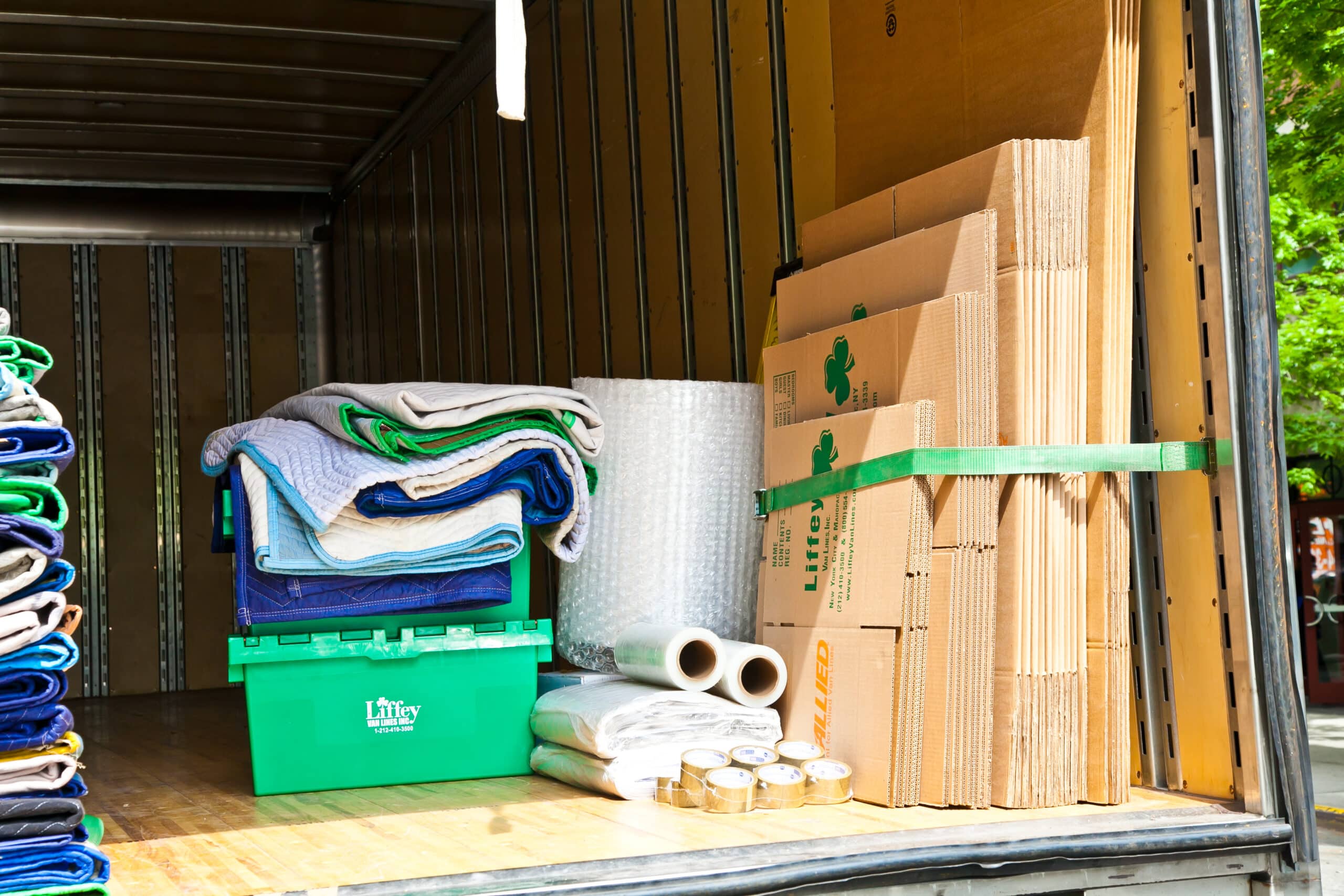Liffey Moving team preparing equipment outside NYC brownstone ahead of scheduled move